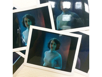 Behind-the-scenes snapshot from the shoot showing polaroid tests