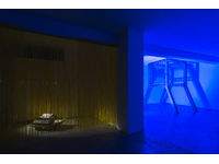 artwork 3c: Laura Rosser HITL (Human-in-the-Loop), dot matrix printer, spotlights, yellow curtains, 2025