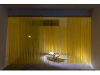 artwork 3: Laura Rosser HITL (Human-in-the-Loop), dot matrix printer, spotlights, yellow curtains, 2025