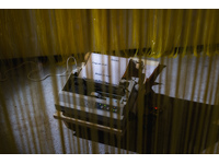 artwork 3b: Laura Rosser HITL (Human-in-the-Loop), dot matrix printer, spotlights, yellow curtains, 2025